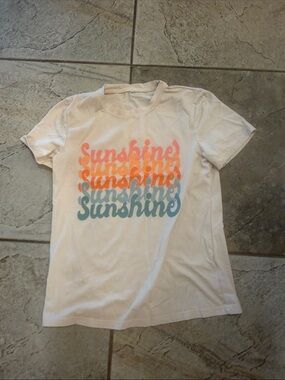 Women’s T-shirt. I am a teacher. It’s one of my teacher T-shirts. Worn 1X